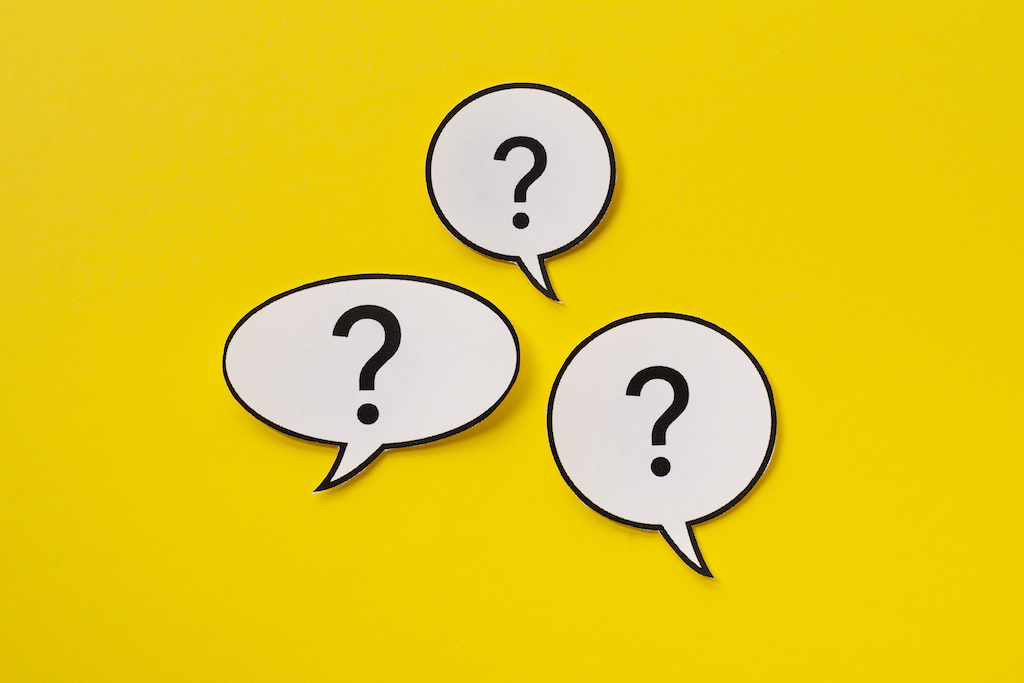 Three white speech bubbles with question marks and yellow background, representing FAQs about electrical repair.