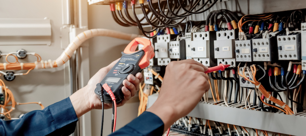 Electrical safety inspection using a multimeter to prevent anything hazardous. Emergency electrician. 