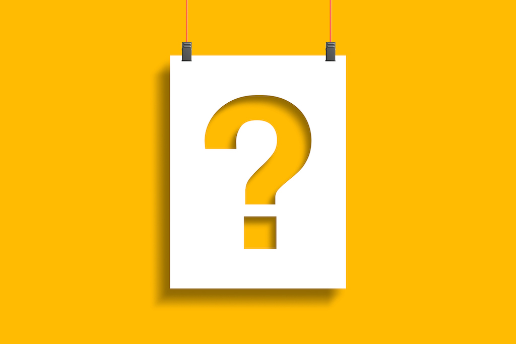 Question mark on paper hanging from string on yellow background. Emergency electrical repair FAQ.