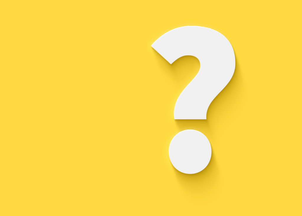 Yellow background with white question mark representing questions about surge protection.