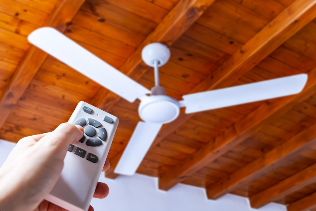 Ceiling fan and remote control on wood ceiling. | Ceiling fans