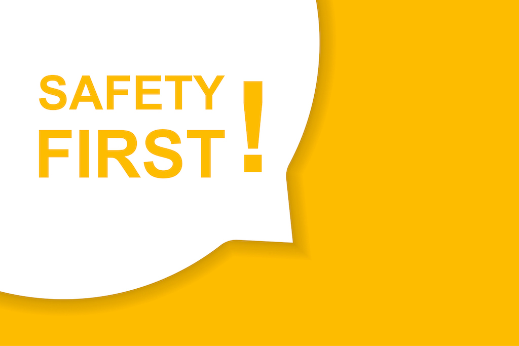 Speech bubble with the words 'Safety First!' on yellow background. Discussing safety measures during residential electrician service.