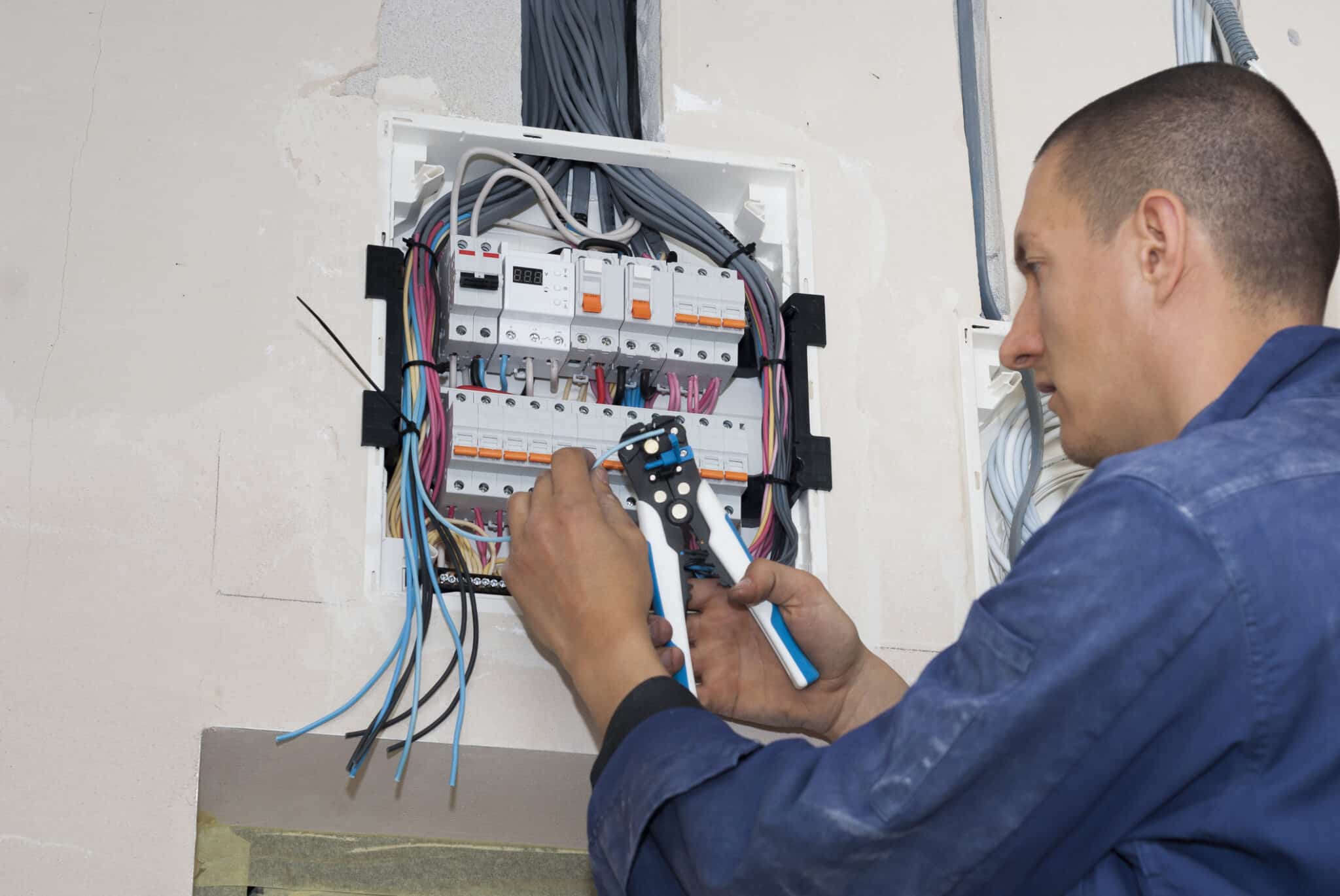 Electrician Checking Wire System.